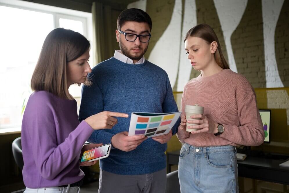 Commercial Painters Holding Notebook for Selecting Colours